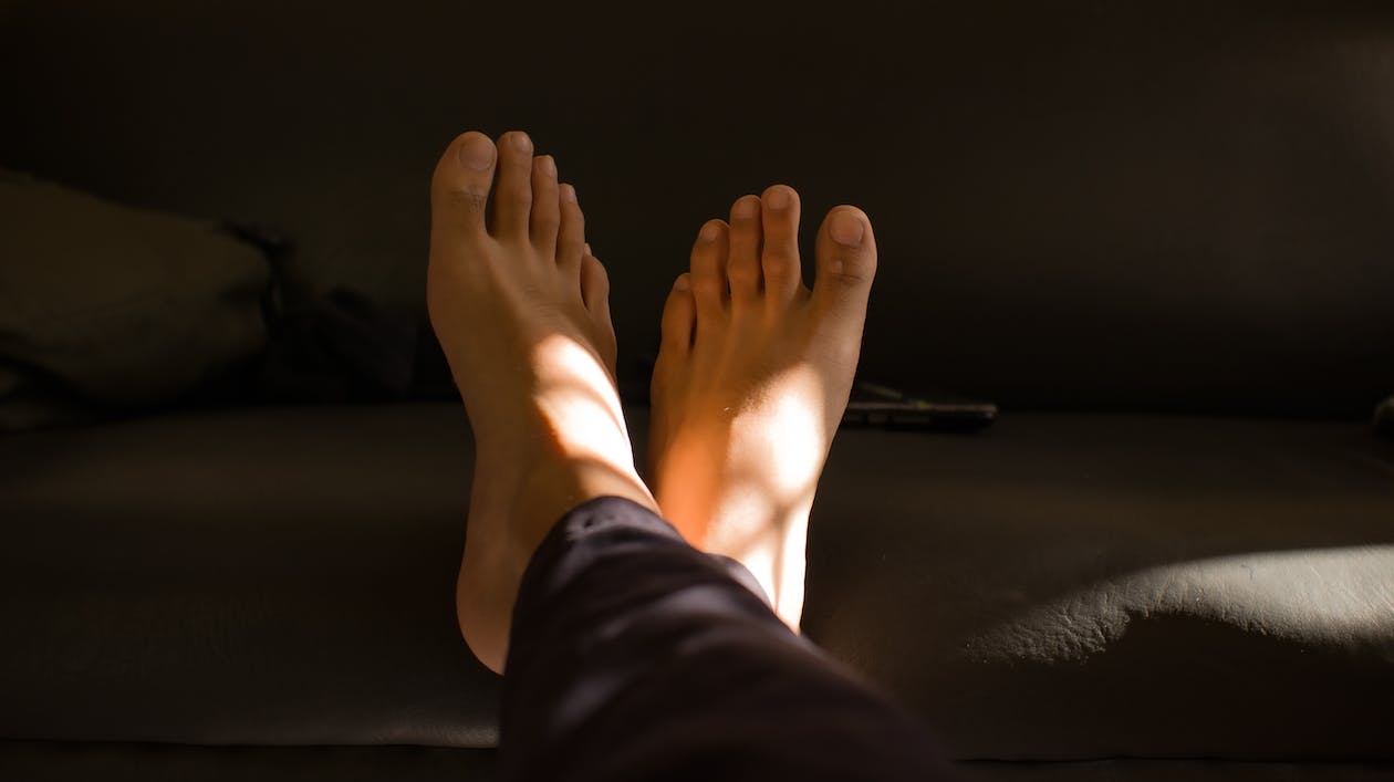 Healthy-looking toenails in a sunlit room, post a successful outcome of a toenail fungus treatment in Los Angeles.